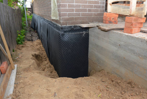 Happy homeowners after waterproofing job in Burnsville